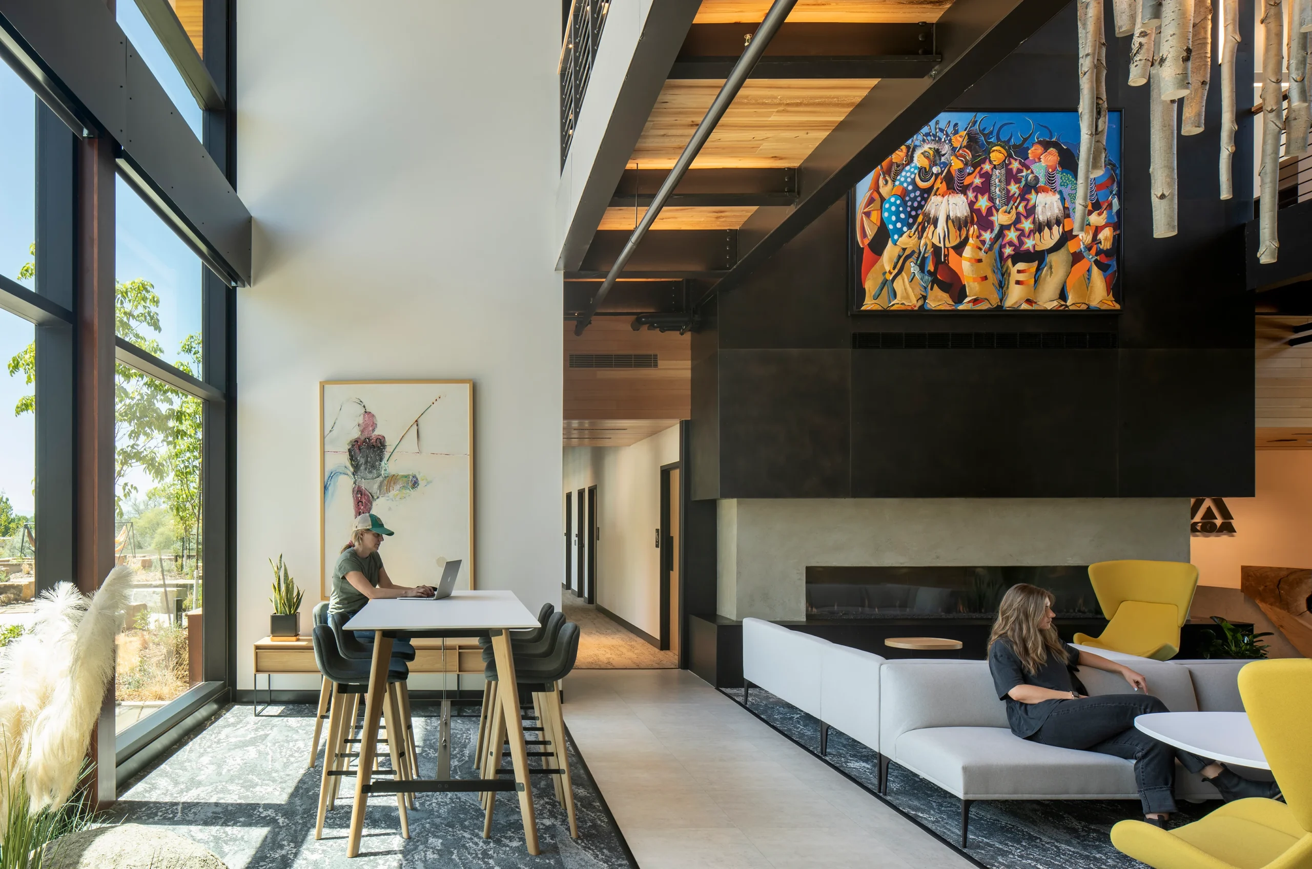 The lobby at KOA Corporate Headquarters, featuring modern furnishings, natural materials, and curated artwork.